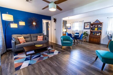 Living room featuring dark wood-type flooring and 