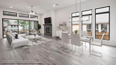 Living area with a ceiling fan, recessed lighting