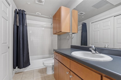Bathroom featuring vanity, tile patterned floors,