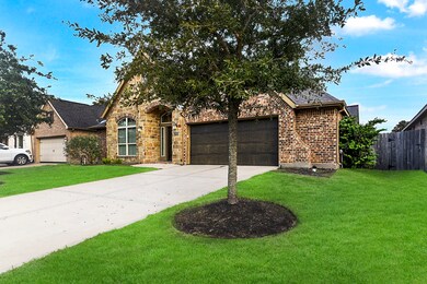 A spacious driveway leads to a two-car garage with 5 foot extension an automatic remote door opener, while a delightful pathway guides you to the arched entryway and its covered porch to the door.