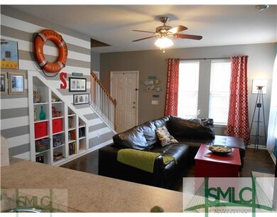 Living Room. Living room opens to kitchen and offe