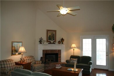 LIVING ROOM W/ VAULTED CEILING, FRENCH DOORS ONTO 