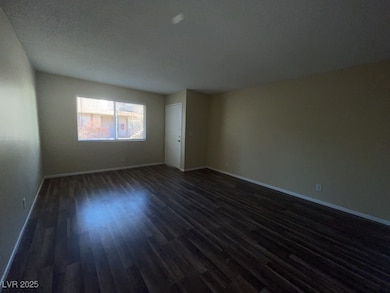 View of spacious living room from dining area