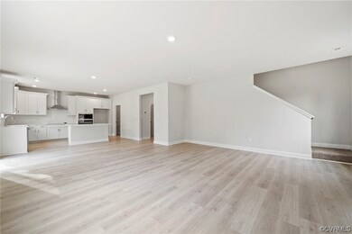 Unfurnished living room with light hardwood / wood