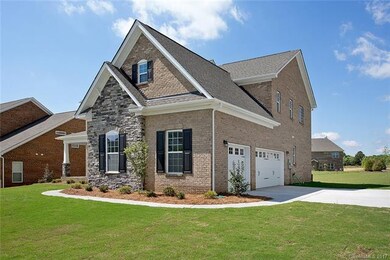 Side load 3 car garage w.plenty of extra space on 