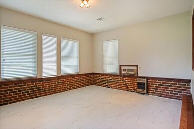 Empty room featuring a wall unit AC