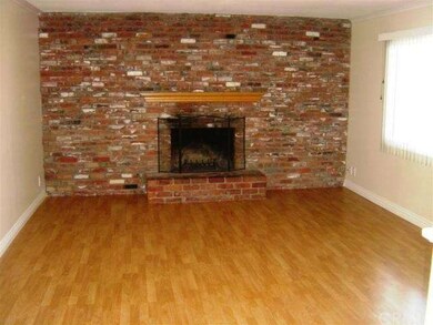 Large living room with real wood burning fireplace