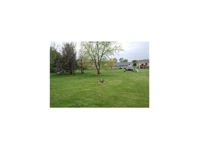 Exterior Back. 1/2 acre lot.