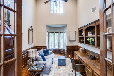 Handsome Study with a spiral staircase leading to 