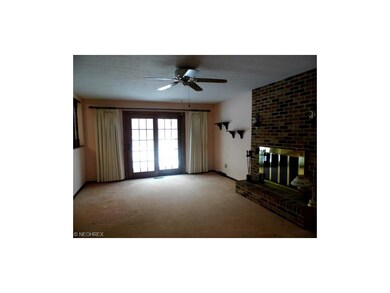 Spacious family room with wood burning fireplace a
