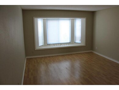 Den. Retrofitted windows downstairs. Laminate wood
