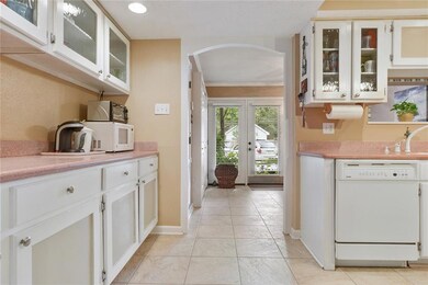 View from kitchen to entrance and den area