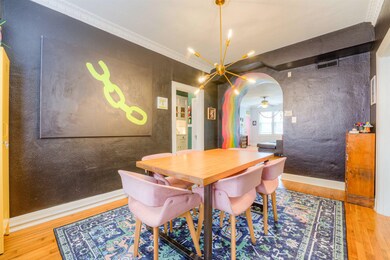 Dining room featuring arched walkways, visible ven