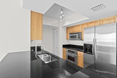 Gourmet kitchen features  European cabinetry, gran
