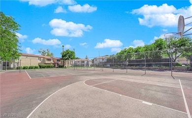 View of basketball court featuring community baske