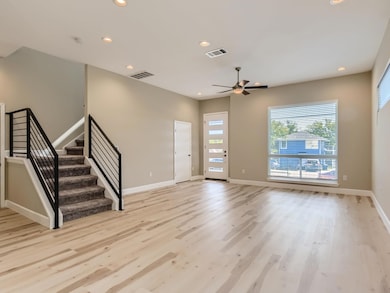 Unfurnished living room featuring visible vents, 