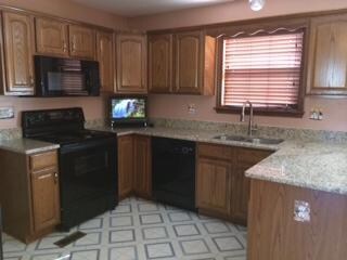 New granite kitchen complete with breakfast bar and eat in nook. All appliances remain including LG front load washer and dryer