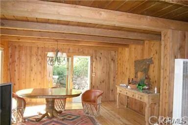 Dining area with access to patio & pool