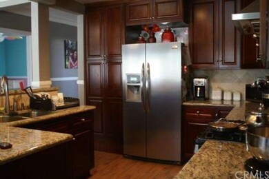 Updated kitchen with stainless steel appliances and granite counter tops. 
