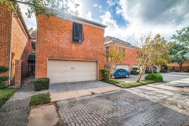 Classic brick construction, a private gate, and tw