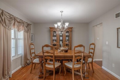 Formal dining space with lovely hardwood floors.