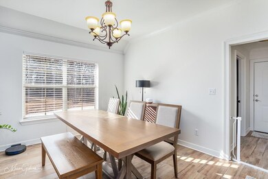 Dining space featuring an inviting chandelier, ple