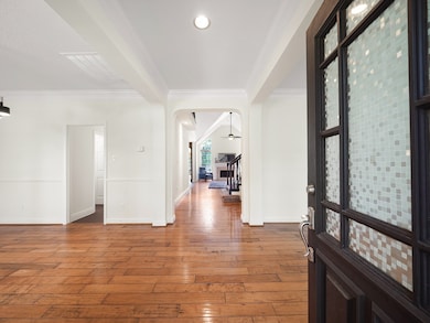 Step inside to gleaming hardwood floors, soft whit