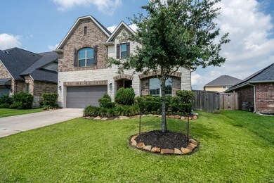 As you approach the front entrance you are greeted by well-maintained exterior of stone and brick. Home has great curb appeal!