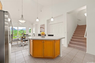 The kitchen island with additional cabinet and counter top space is ideal for meal prep, entertaining guests, or enjoying casual dining. ENHANCED PHOTO: IMAGE HAS BEEN VIRTUALLY STAGED.