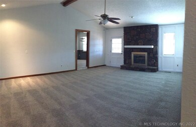 Spacious living room with vaulted ceiling is perfe