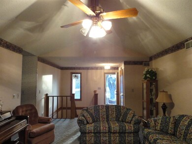 Living room view from fireplace towards front door