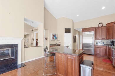 The kitchen also offers a see through fireplace, p