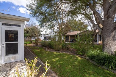 Rear elevation with mature landscaping providing p