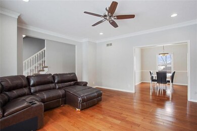 Living room opens to the dining room! Crown moldin