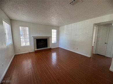 Unfurnished living room with a textured ceiling, d