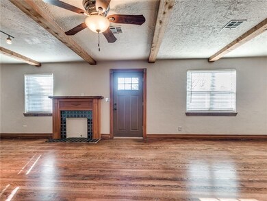 Living room facing front door and fireplace.