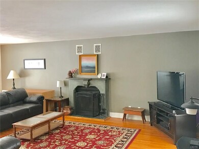LIVING ROOM WITH CUSTOM WOODBURNING FIREPLACE