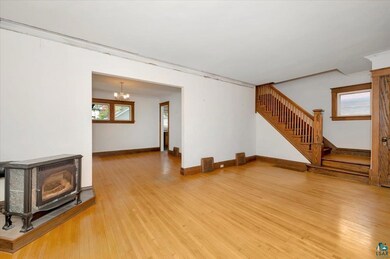 Unfurnished living room with hardwood / wood-style