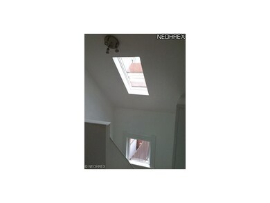 Skylight over stairwell adds natural light.