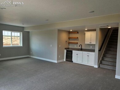 Unfurnished living room with a textured ceiling, c