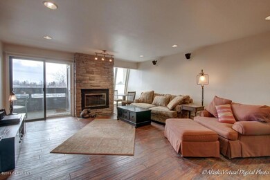 Living Room W/Stone Surround Fireplace