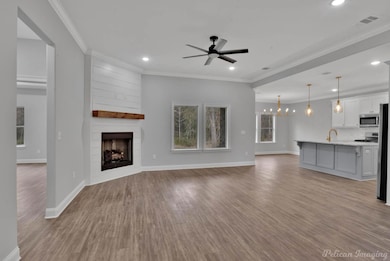 Unfurnished living room with a large fireplace, li