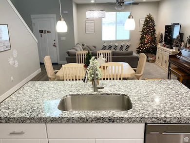 Dining room with recessed lighting, ceiling fan, and wood finished floors