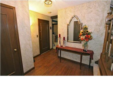 Large Foyer with hardwood floors