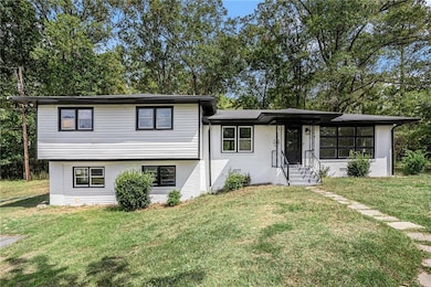 Split level home with a front yard