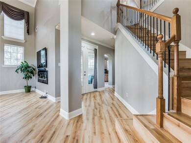 Gorgeous flooring invites you to walk into this ho