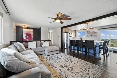 The living room also receives lots of light from the kitchen windows. The kitchen wall has been opened up to create a large open entertaining area.
