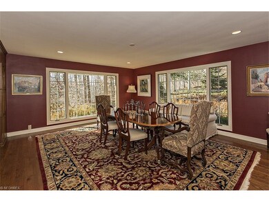 Floor to ceiling windows accent the formal dining 