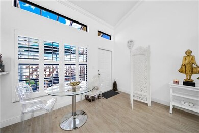 Entry and dining area with view to private patio