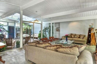 Floor to ceiling glass on two sides of the living 